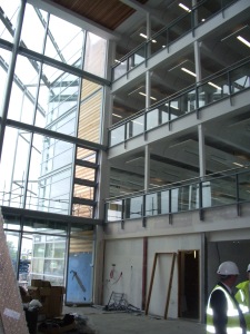 The atrium faces due west, with 2 curtain walls of glass.
